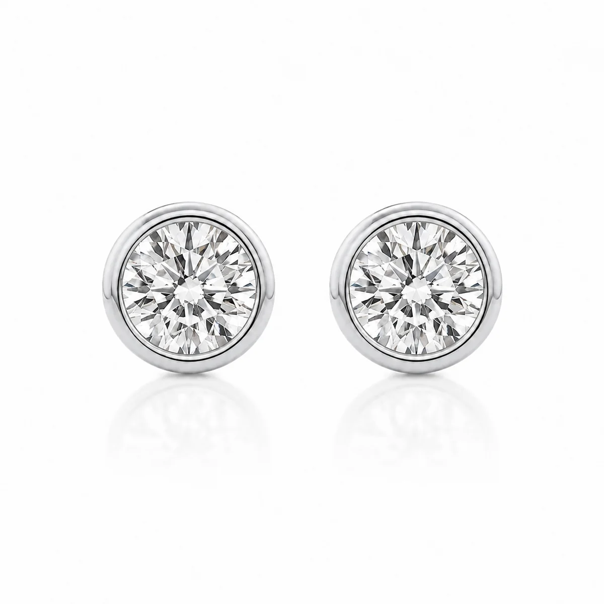 Bezel studs diamond earrings in platinum, round diamond, made to order by Prodiam (rendered design reference)