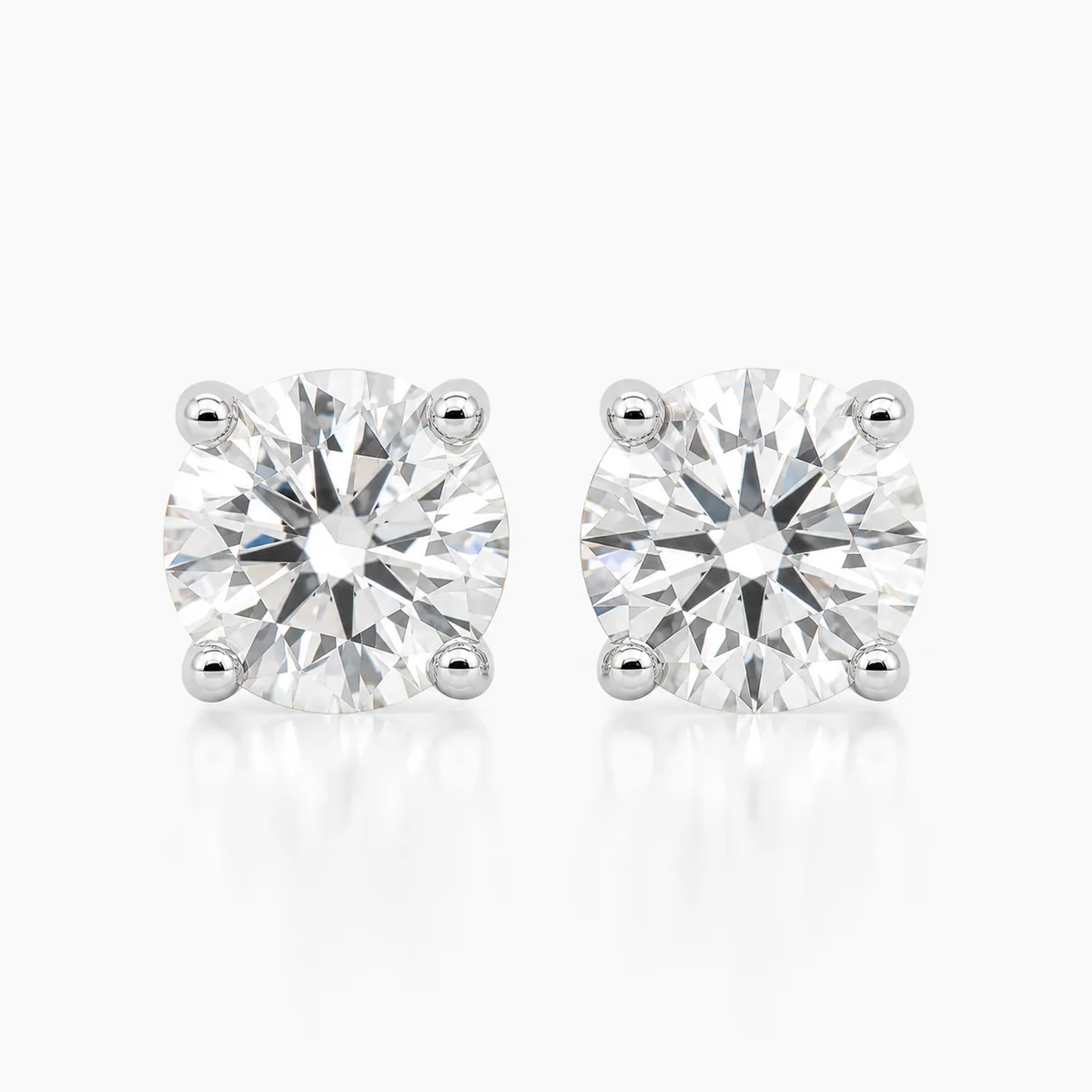 Four-claw studs diamond earrings in 18k white gold, round diamond, made to order by Prodiam (rendered design reference)