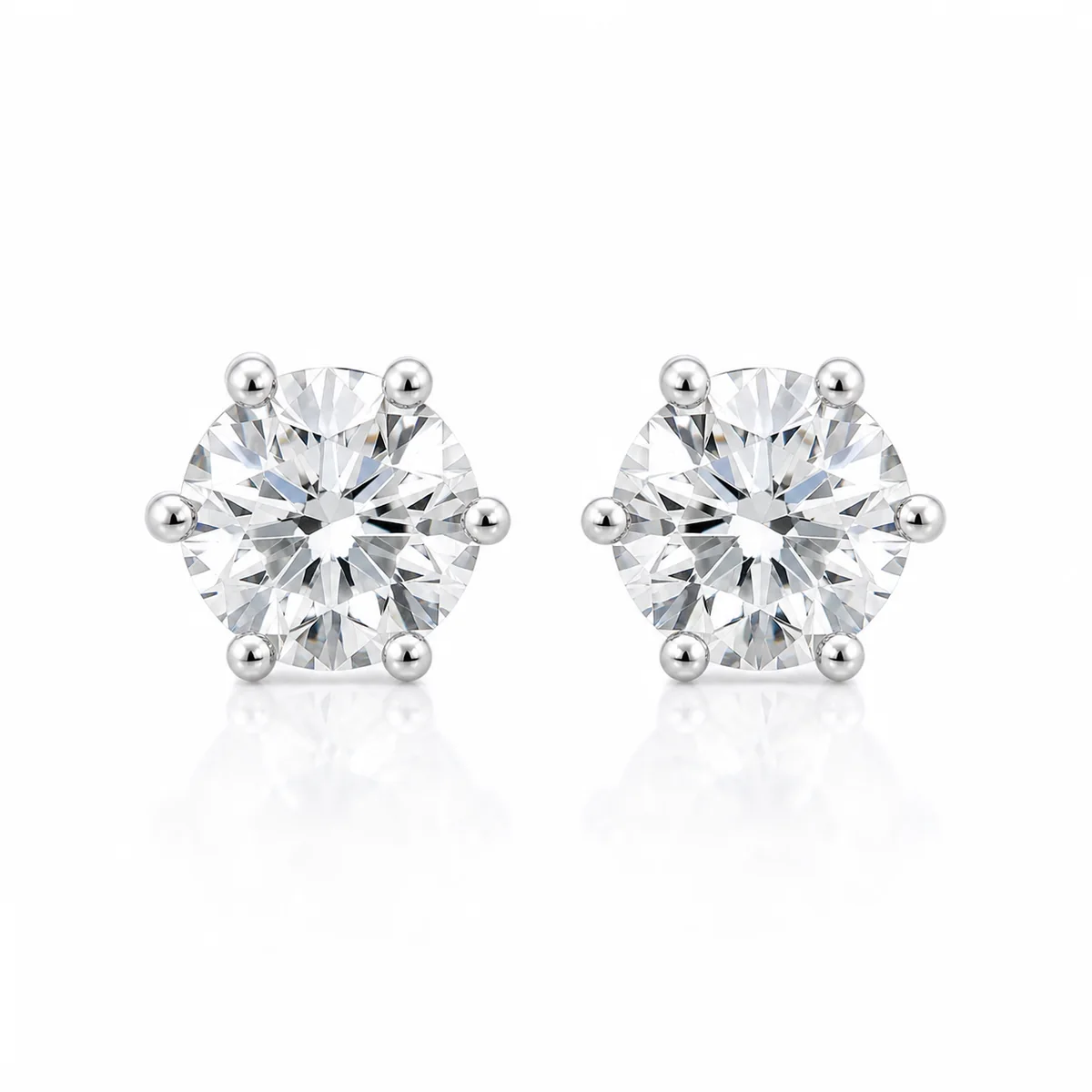 Six-claw studs diamond earrings in platinum, round diamond, made to order by Prodiam (rendered design reference)