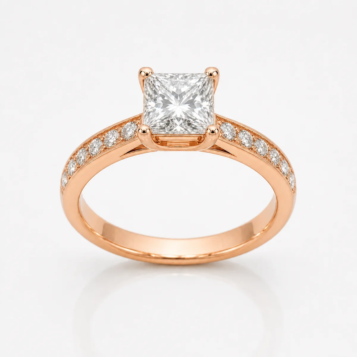 Princess with side stones engagement ring in 18k rose gold, made to order by Prodiam (rendered design reference)