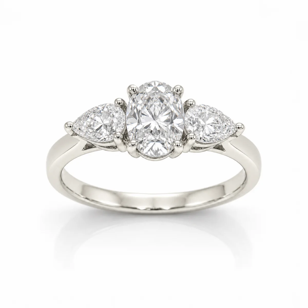 Three-stone pear sides engagement ring in 18k white gold, oval diamond, made to order by Prodiam (rendered design reference)