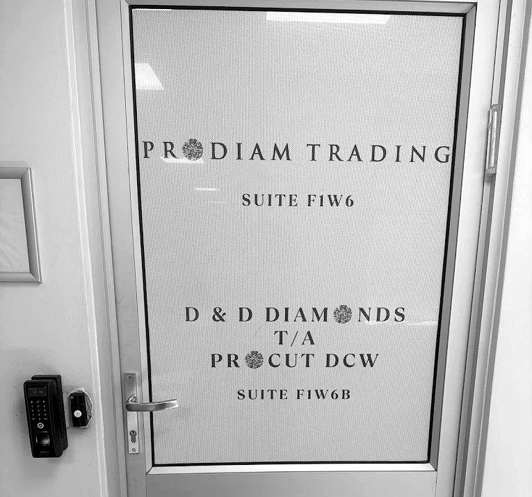 The office door at Suite F1W6 and F1W6B, The Paragon, 1 Kramer Road, Bedfordview: PRODIAM TRADING Suite F1W6 above D and D DIAMONDS trading as PROCUT DCW Suite F1W6B, with a biometric access lock