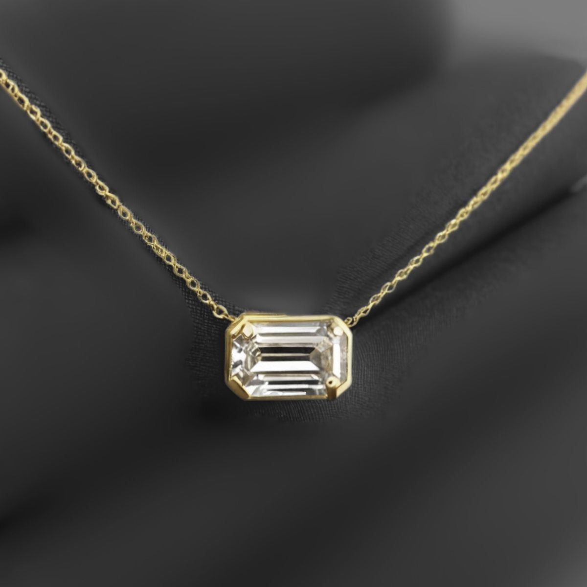 1.12Ct Emerald Diamond Pendant Necklace · 1.12 ct, Emerald Cut, F colour, SI1 clarity, EGL certified, Yellow Gold · alternate angle, photographed at the Bedfordview viewing room